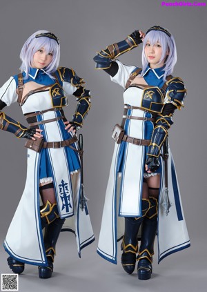 A couple of women dressed in costumes posing for a picture.