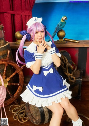 A woman dressed as a pirate sitting on a wooden boat.