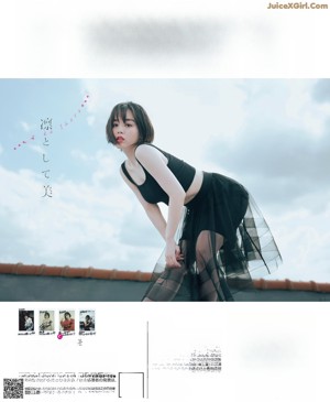 A magazine with a woman in a white dress on the cover.